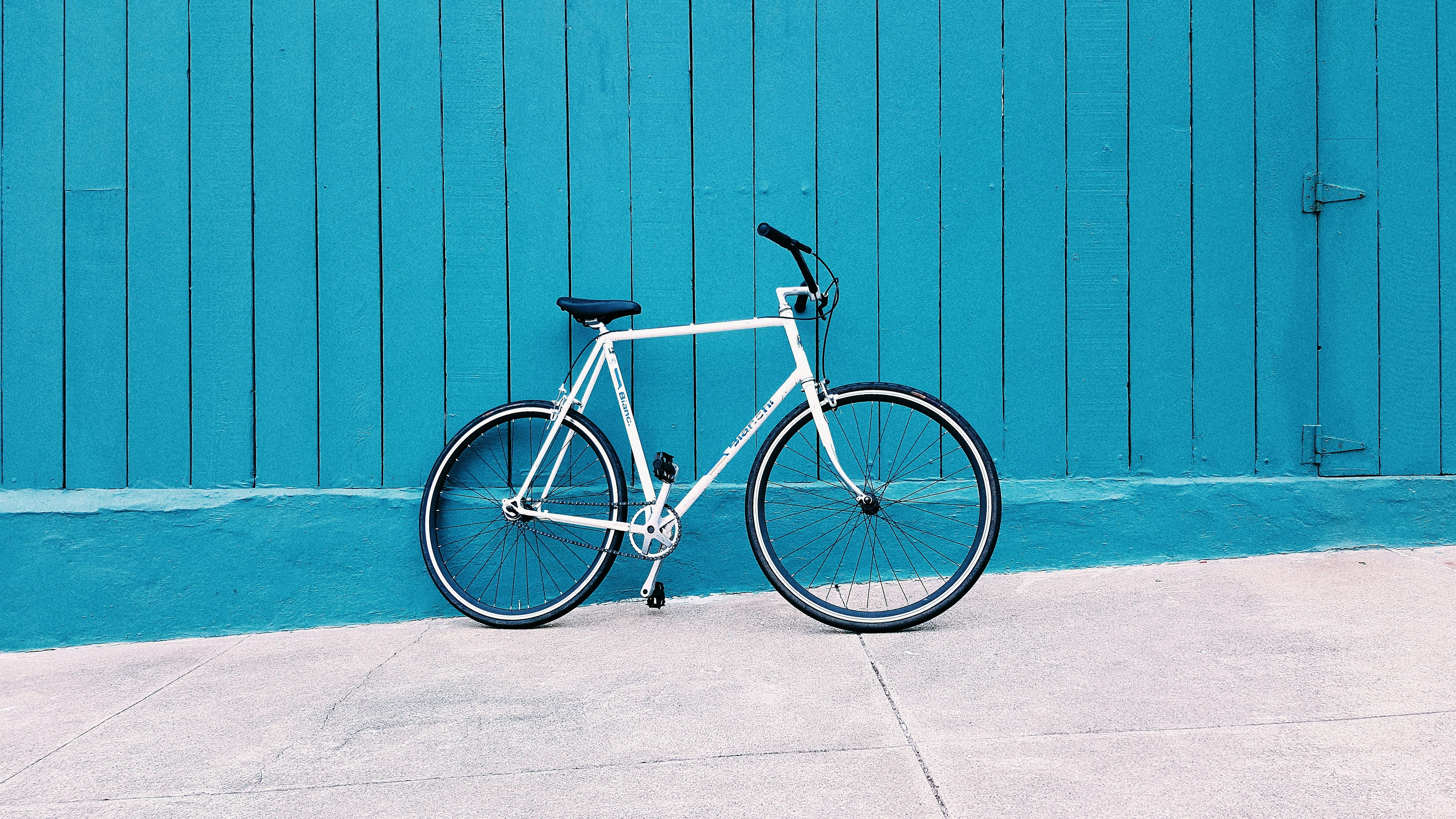 BikeZone — white city bike on blue wall, e-commerce concept
